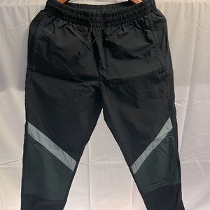 Small green/black track pants